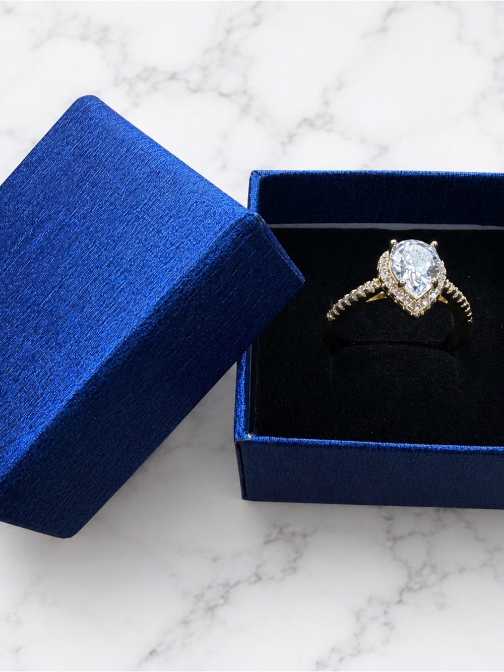 Gold Pear-Cut Halo Ring with Clear Stone. 925 silver. Gold-plated.